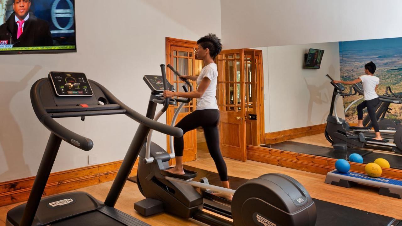 Drostdy Hotel Graaff-Reinet Exteriör bild A woman using a cross trainer