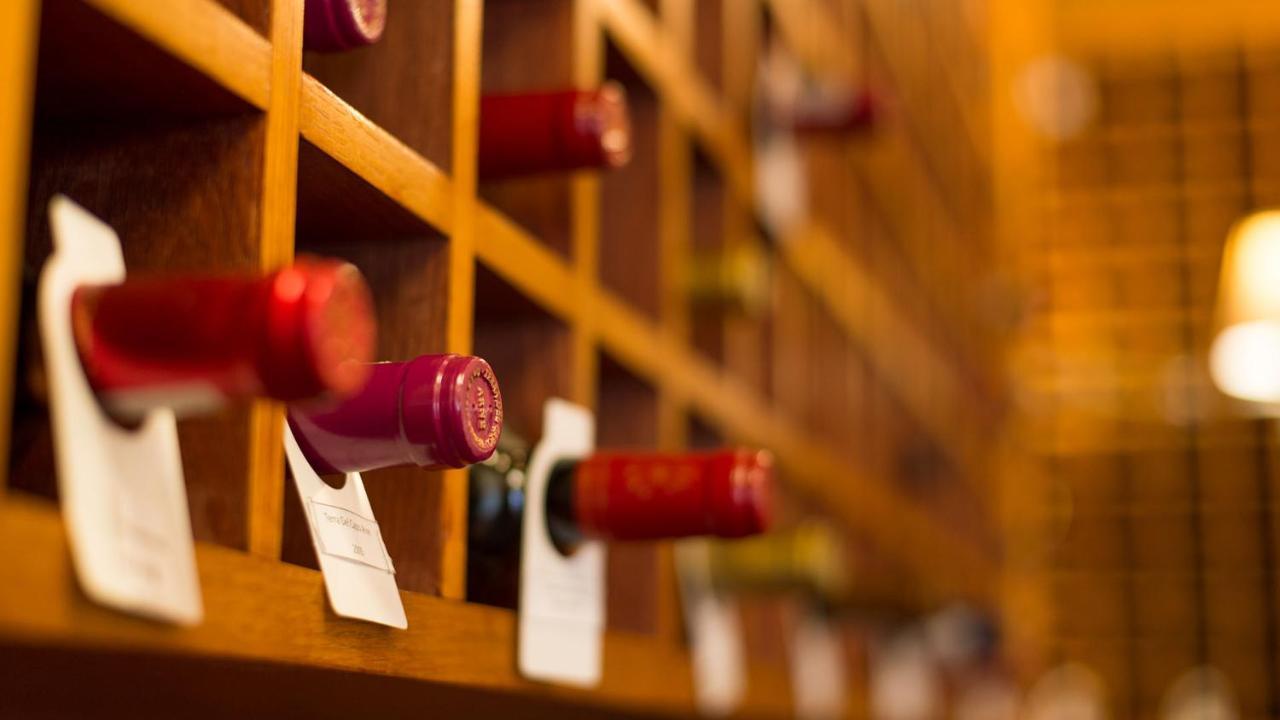 Drostdy Hotel Graaff-Reinet Exteriör bild Wine bottles in a wine rack