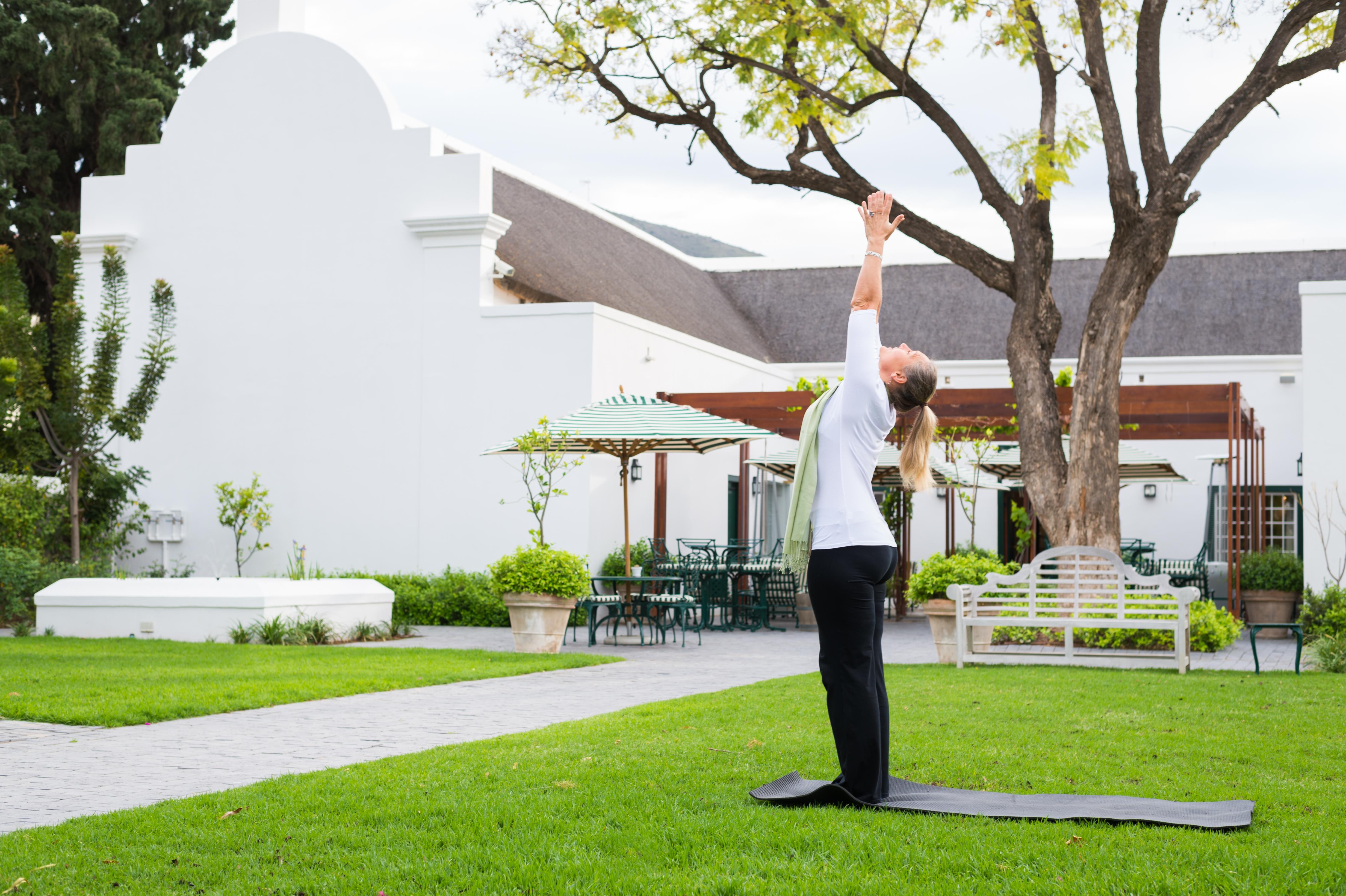 Drostdy Hotel Graaff-Reinet Exteriör bild A woman practicing yoga at the Cape of Good Hope